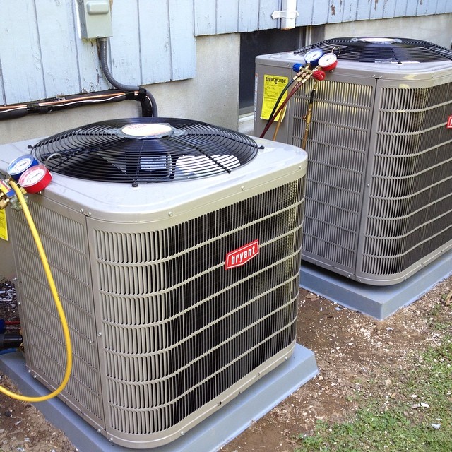 Maintenance being done on 2 ac units
